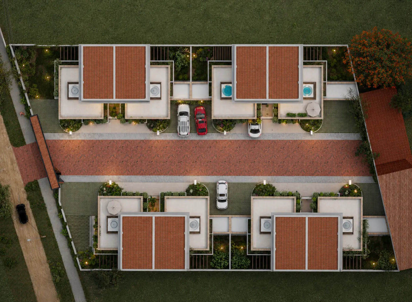 Vista aérea del conjunto: una calle privada en adoquín con cuatro casas a cada lado