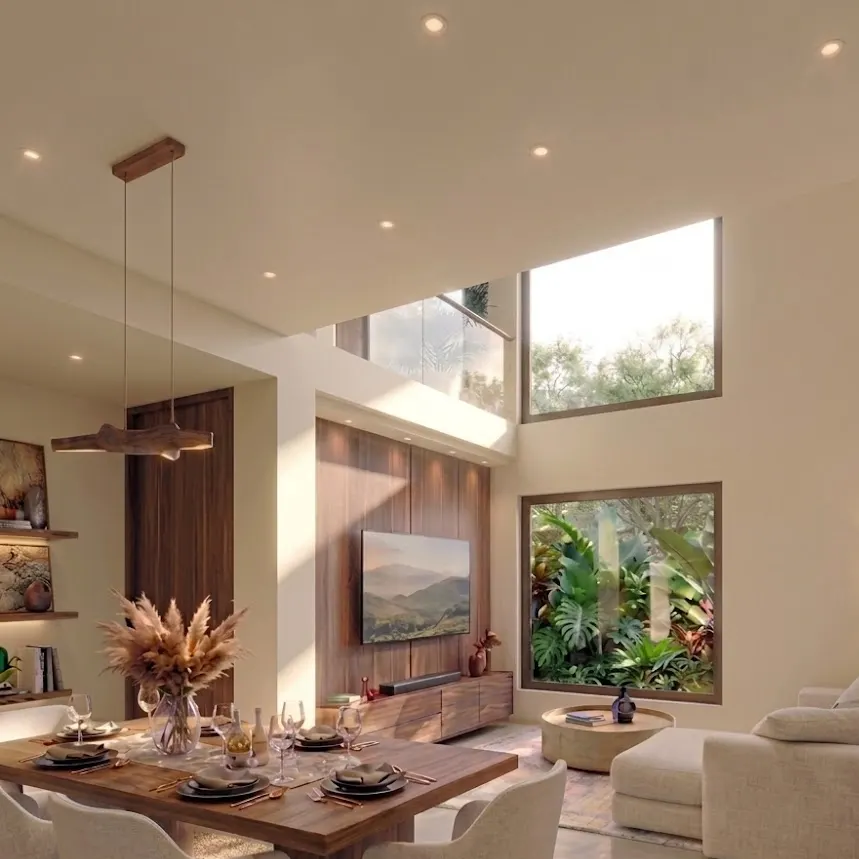 Sala con vacío a doble altura y ventanal alto